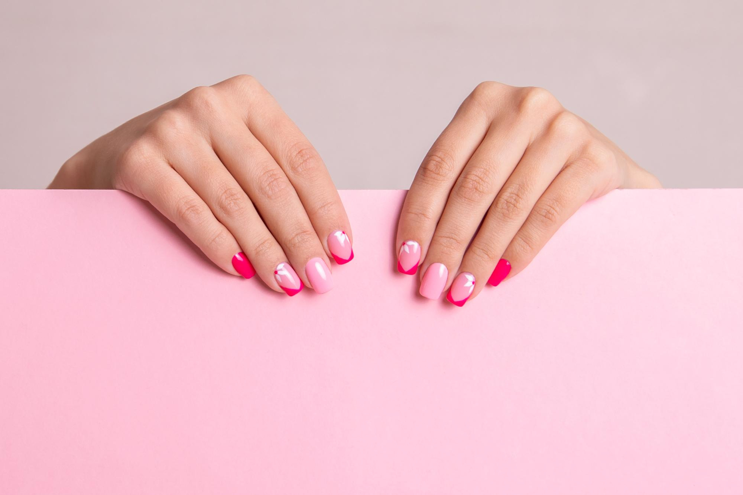 beautiful-female-hands-with-fashion-manicure-nails-flowers-design-pink-gel-polish (2)